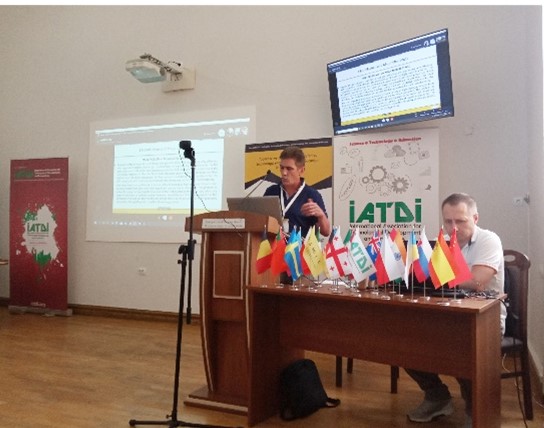 Доповідач Олег Онисько (англійською) 